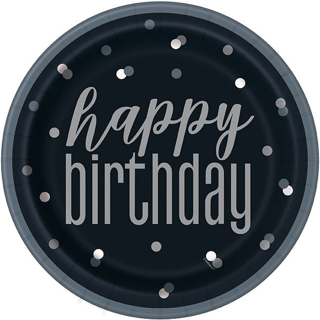 Round black paper plate with silver "happy birthday" text and scattered silver polka dots around the border.