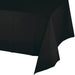 Black velvet rectangular tablecloth draped to show its soft texture and deep black color against a white background.