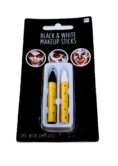Black and white makeup sticks set with gold-spotted handles displayed on black packaging showing three theatrical face designs.