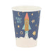 Blue disposable paper cup featuring a colorful rocket ship illustration surrounded by stars, moons, and the text "Blast Off" against a white cloud base.