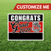Graduation-themed customizable sign with 'Congrats Grad 2026' on a grass background