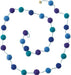 Long beaded garland with blue, teal, and purple pom poms connected by wire, arranged in a looping display.