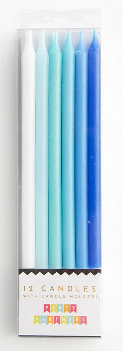 Box of 12 blue gradient taper candles with holders, ranging from white to deep blue, labeled "Party Partywares" on the packaging.