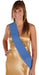 Woman wearing a gold satin wrap dress with a blue satin sash draped diagonally across the body.