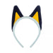 Plush cat ear headband with a light gray band, dark navy outer ears, and bright yellow inner ears.