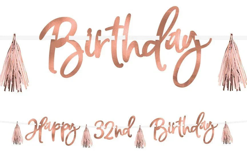 Rose gold metallic banner set with "Birthday" text and "Happy 32nd Birthday" banner, decorated with blush pink tassel fringe accents.