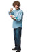 Man wearing a light blue denim shirt and jeans holds a painter's palette with colorful paint swatches while pointing toward the camera with a friendly smile.