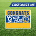 Custom yard sign with blue and yellow stripes reading "CONGRATS Grad 2026" and the Bonneville High School Bakers logo, displayed on a grass background.