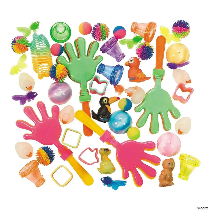 Colorful assortment of fifty novelty toys including green and pink hand-shaped grabbers, textured balls, animal figurines, whistles, spinning tops, and small plush toys in bright colors arranged on white background.