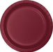 Deep burgundy paper plate with a ridged rim and slightly recessed center, shown from above.