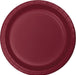 Burgundy disposable paper plate with a ridged rim and circular well design, shown from above.
