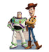 Buzz Lightyear in a white, green, and purple space ranger suit stands next to Woody in a tan cowboy outfit holding a toy horse.