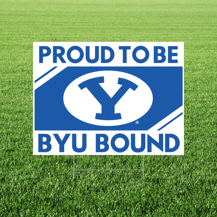 Blue and white yard sign with "PROUD TO BE" text at top, large Y logo in center oval, and "BYU BOUND" text at bottom, displayed on grass.