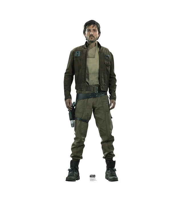 Male figure wearing olive-green military-style jacket and cargo pants with black boots, holding a blaster pistol at his side against a white background.