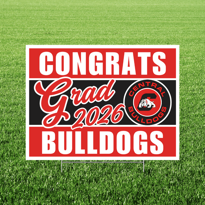 Graduation-themed sign with 'Congrats Grad 2026 Bulldogs' on a grass background