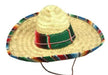 Tan woven straw sombrero with a wide brim trimmed in multicolored stripes, a green fabric band with red and white details around the crown, and a black chin strap.