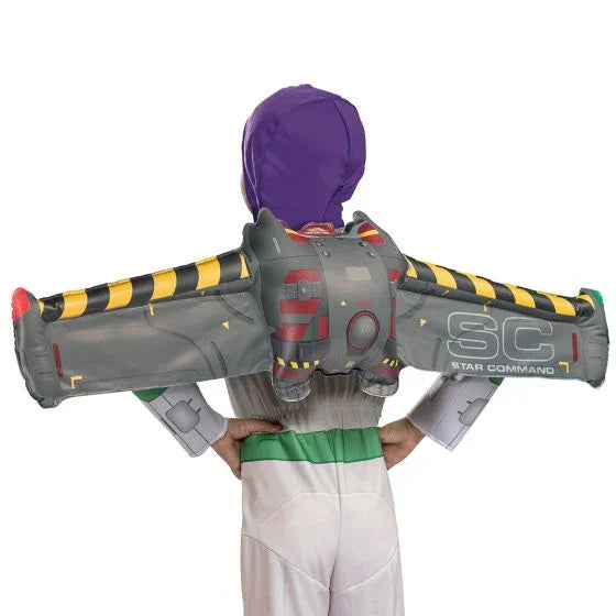 Child wearing gray inflatable jetpack with yellow and black striped arms, purple helmet, and white pants as a space ranger costume accessory.