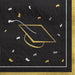 Black beverage napkins with gold and white graduation cap designs and confetti scattered throughout, featuring gold borders on the edges.