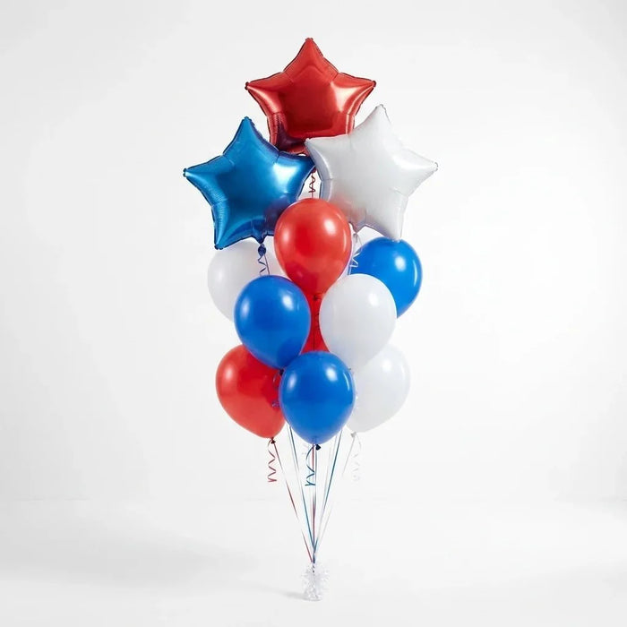 Festive balloon bouquet featuring three red, white, and blue star-shaped foil balloons at the top and eleven matching latex balloons in red, white, and blue arranged below with curled ribbons.