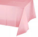 Light pink rectangular plastic tablecloth draped over a surface, showing the fabric's texture and translucent quality against a white background.