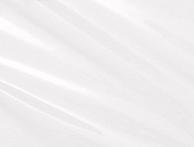 Clear cellophane wrap roll with diagonal light streaks across a white background, showing the transparent plastic material rolled for gift wrapping and decoration purposes.