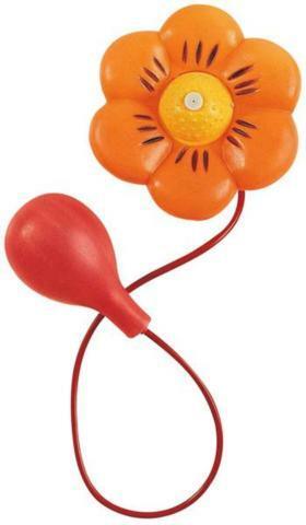 Orange flower with yellow center and black details attached to a red bulb and cord for squirting water.