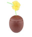 Brown textured coconut-shaped container with a hinged lid and a yellow tissue paper flower with green stem emerging from the top.