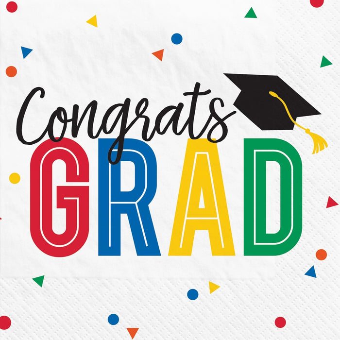 Colorful "Congrats Grad" beverage napkins featuring a black graduation cap with yellow tassel above large letters spelling "GRAD" in red, blue, yellow, and green, surrounded by confetti shapes on a white background.
