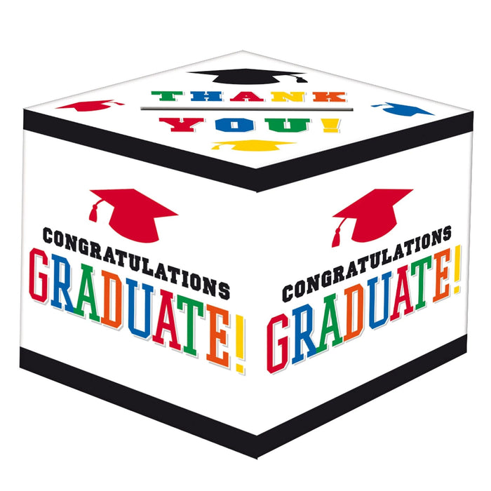 White cubic gift box decorated with colorful "Congratulations Graduate!" text and red mortarboard caps, featuring various academic gown designs on the top panel.