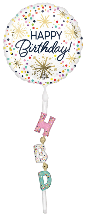 Round white foil balloon with colorful confetti and gold starburst designs reading "Happy Birthday," attached to a white string with three dangling letter balloons spelling "HBD" in pink, white, and teal with confetti patterns.