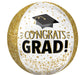 Gold glitter-trimmed spherical balloon with white center, black mortarboard icon, and "CONGRATS GRAD" text in gold and black lettering.