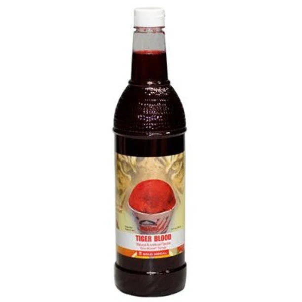 A 25-ounce bottle of Tiger Blood snow cone syrup with a dark red liquid inside, gold patterned label, and red circular fruit imagery on a white background.