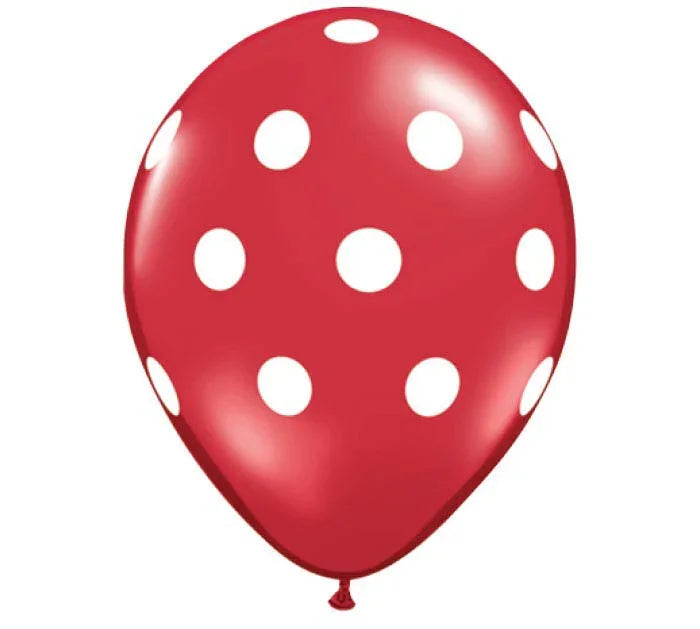 Red latex balloon with white polka dots throughout, featuring a glossy finish and tied knot at the bottom.