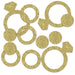 Gold glitter diamond ring and circle shaped confetti pieces arranged on a white background.