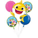 Colorful balloon bouquet featuring a large yellow Baby Shark character face with big eyes and open mouth, surrounded by four smaller circular balloons with Baby Shark characters, pink and blue accents, and yellow fin details.