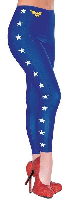 Blue full-length leggings with white stars down the sides, yellow Wonder Woman logo on upper right, paired with red glitter platform heels.