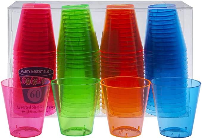 Set of 60 neon plastic shot glasses in bright pink, green, orange, and blue, displayed in clear packaging with four sample cups shown in front.