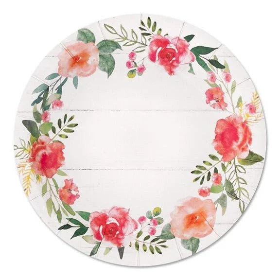 Round white paper plate with a watercolor floral wreath border featuring pink, red, and peach roses with green leaves and a white shiplap wood texture center.