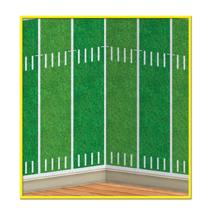 Green football field backdrop with white yard line markings and hash marks, featuring a yellow border frame and wooden floor base.