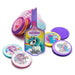 Colorful mesh bag containing unicorn-themed sticker sheets and candy rounds in purple, pink, and turquoise with unicorn illustrations and rainbow designs.