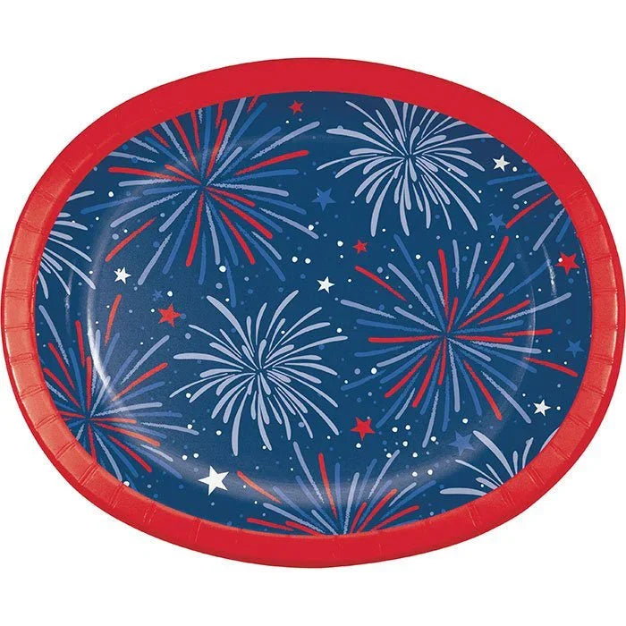 Red oval paper platter with dark blue background featuring red, white, and light blue firework bursts and scattered stars throughout.