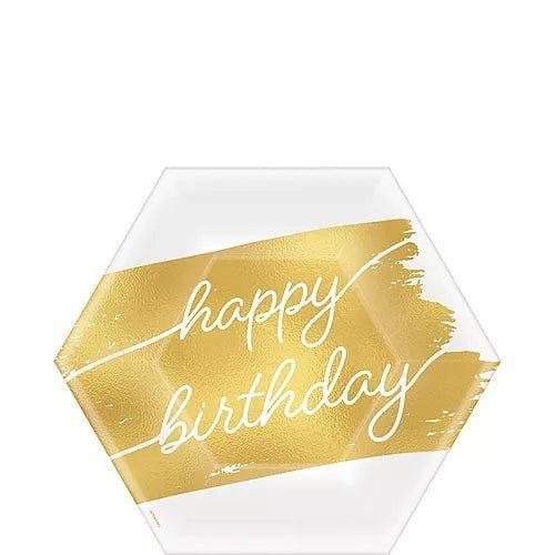 White hexagonal paper plate with a gold foil brushstroke design and white script text reading "happy birthday.