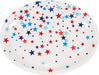 White oval plastic tray decorated with scattered red, navy blue, and light blue stars of varying sizes.