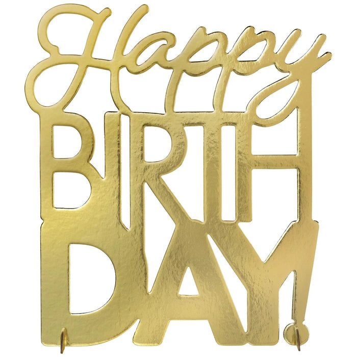 Brass-colored metal cutout spelling "Happy Birthday" with decorative flourishes at the top and two small feet at the bottom for standing display.
