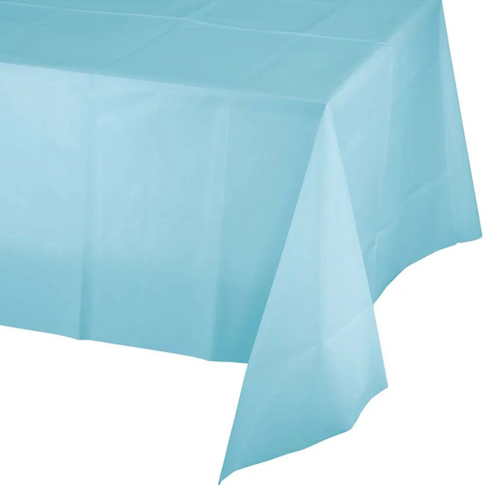 Light blue rectangular plastic tablecloth draped over a table, showing the smooth fabric with natural folds and draping along the edges.