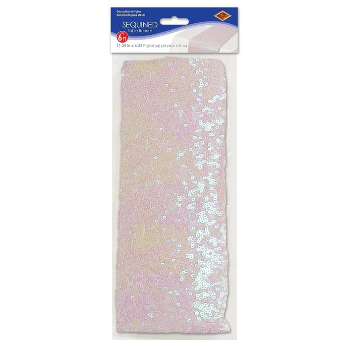 Packaged sequined table runner in shimmering pink, gold, and white with iridescent sequins arranged in a diagonal gradient pattern across the 6-foot length.