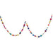 Colorful beaded garland with multisize pompoms in pink, purple, blue, teal, yellow, and orange strung in two draped loops against a white background.