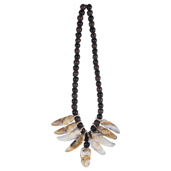Two strands of dark beads suspend a cluster of translucent brown and cream carved bone tooth-shaped pendants with a small skull charm at the center bottom.