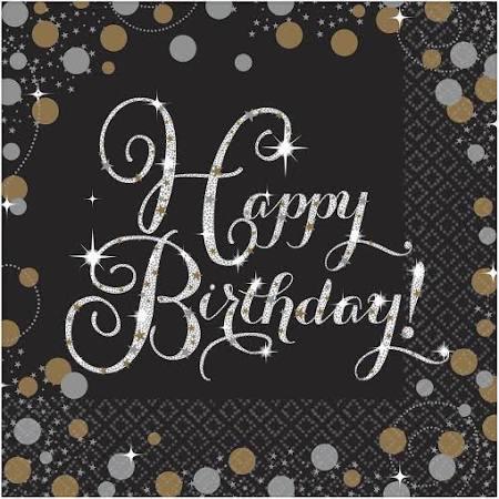 Black luncheon napkin with white cursive "Happy Birthday" text surrounded by gold and silver decorative circles and sparkle accents.