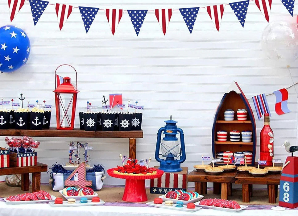 Red, white, and blue pennant banner with alternating striped and star-patterned triangular flags strung across white shiplap backdrop for patriotic decoration.